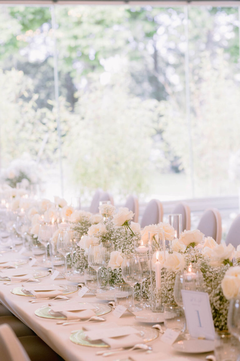 Long banquet table with a white flower runner, Dream Paris Wedding