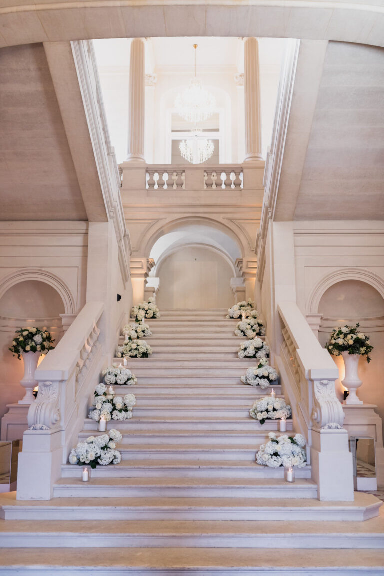 Grand staircase dressed with white and blush flowers, Hotel de Crillon, Dream Paris Wedding