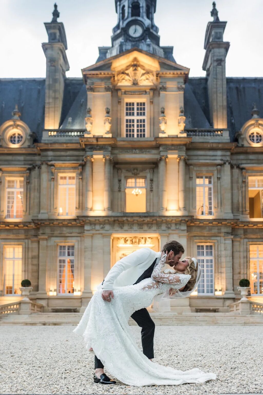 Floodlit chateau facade at night, Dream Paris Wedding