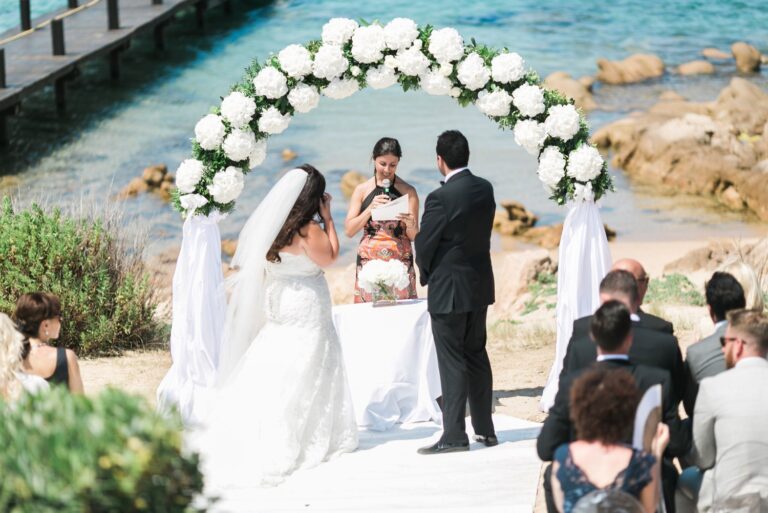 Beach ceremony under a white flower arch at Hotel Pitrizza, Porto Cervo, Sardinia, Dream Weddings By Francesca Resciniti