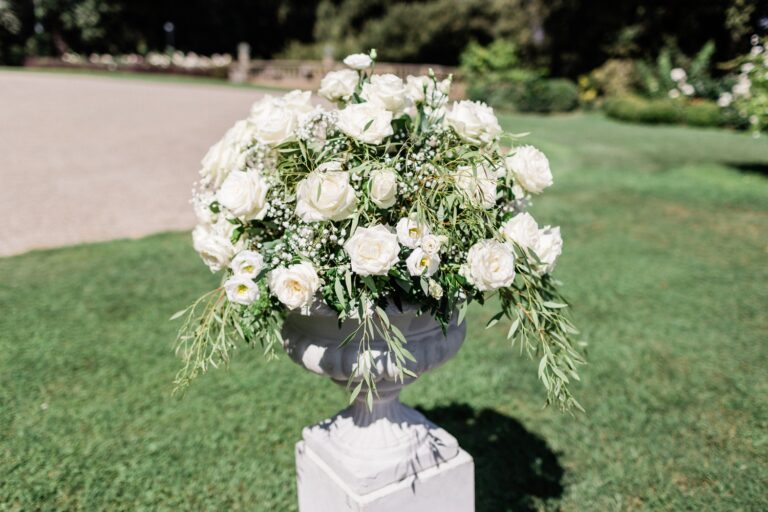 White roses in a stone urn on the lawn at Villa La Ferdinanda, Tuscany, Dream Weddings By Francesca Resciniti