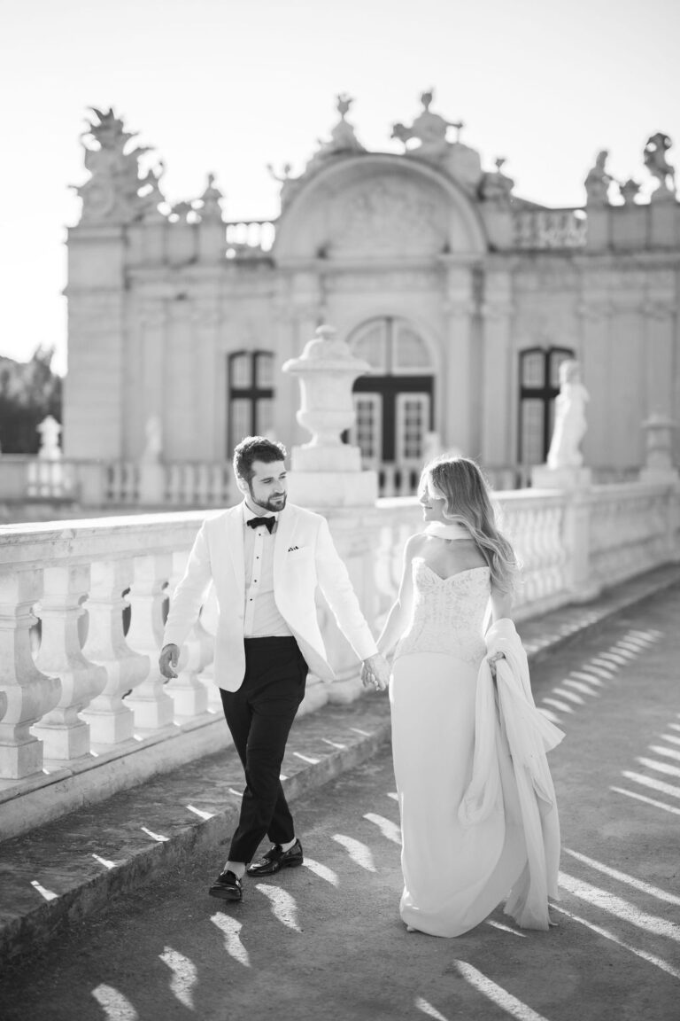 Couple walking along a balustraded terrace, black and white, Dream Weddings Europe