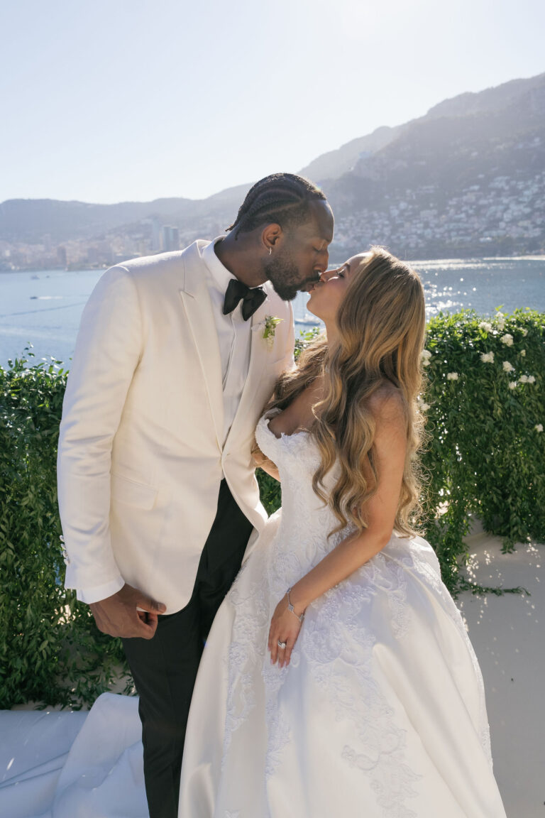Couple kissing on a terrace above the sea, Dream Weddings Europe
