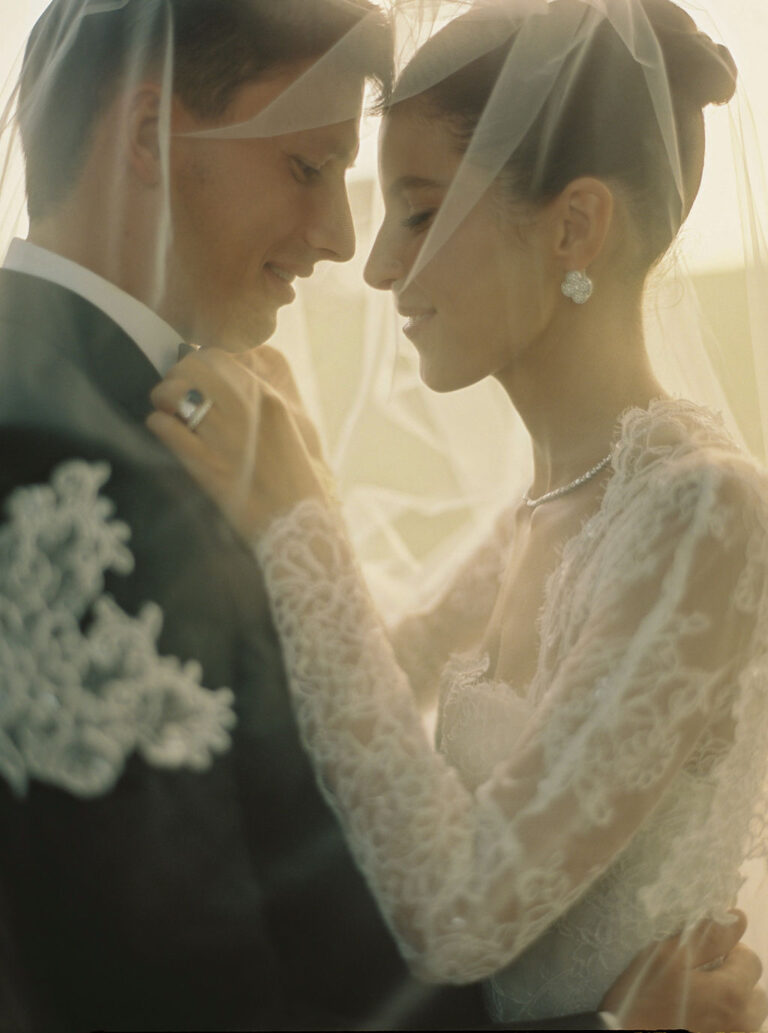 Couple close together beneath a lace veil, Dream Weddings Europe