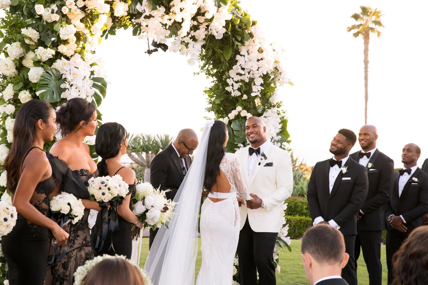 Couple and wedding party at the ceremony arch, Montage Laguna Beach, Duke Photography