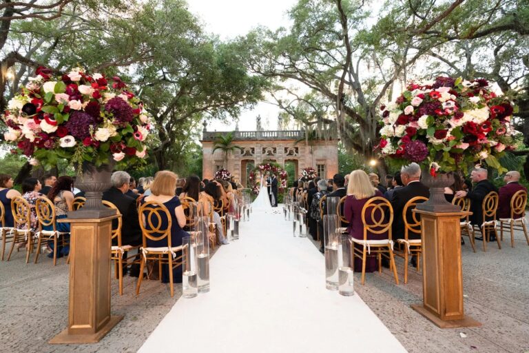 Candlelit aisle and floral ceremony set-up beneath oak trees, Vizcaya Museum and Gardens, Miami, Duke Photography