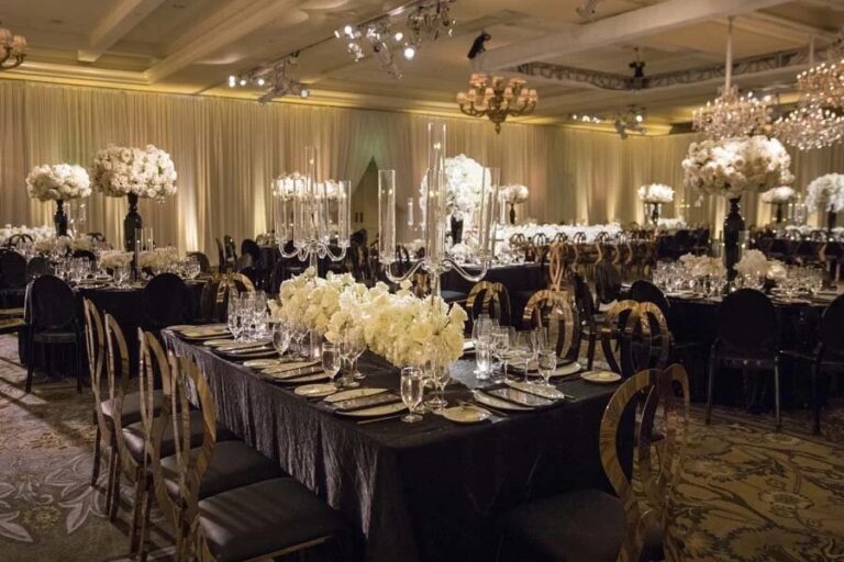 Long reception tables set with white flowers and gold chairs, Montage Laguna Beach, Duke Photography
