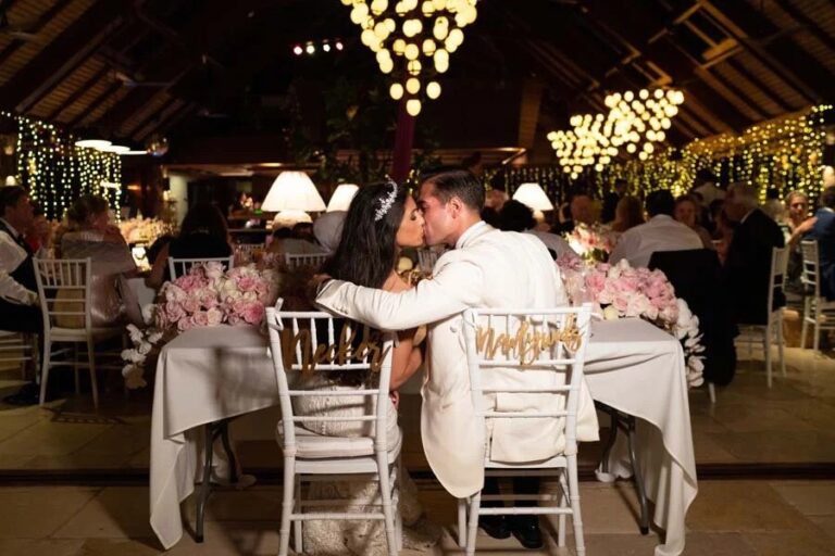 Wedding dinner in a timber pavilion with pink flowers, Necker Island, British Virgin Islands, Duke Photography