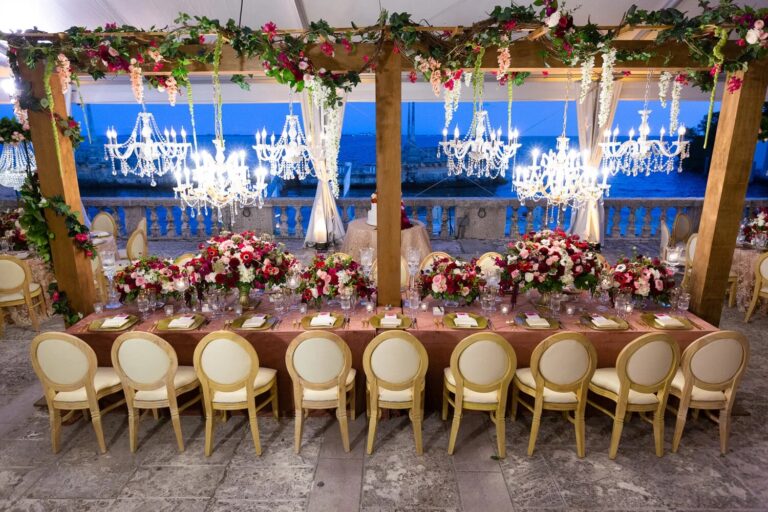 Long reception table with chandeliers and burgundy florals, Vizcaya Museum and Gardens, Miami, Duke Photography