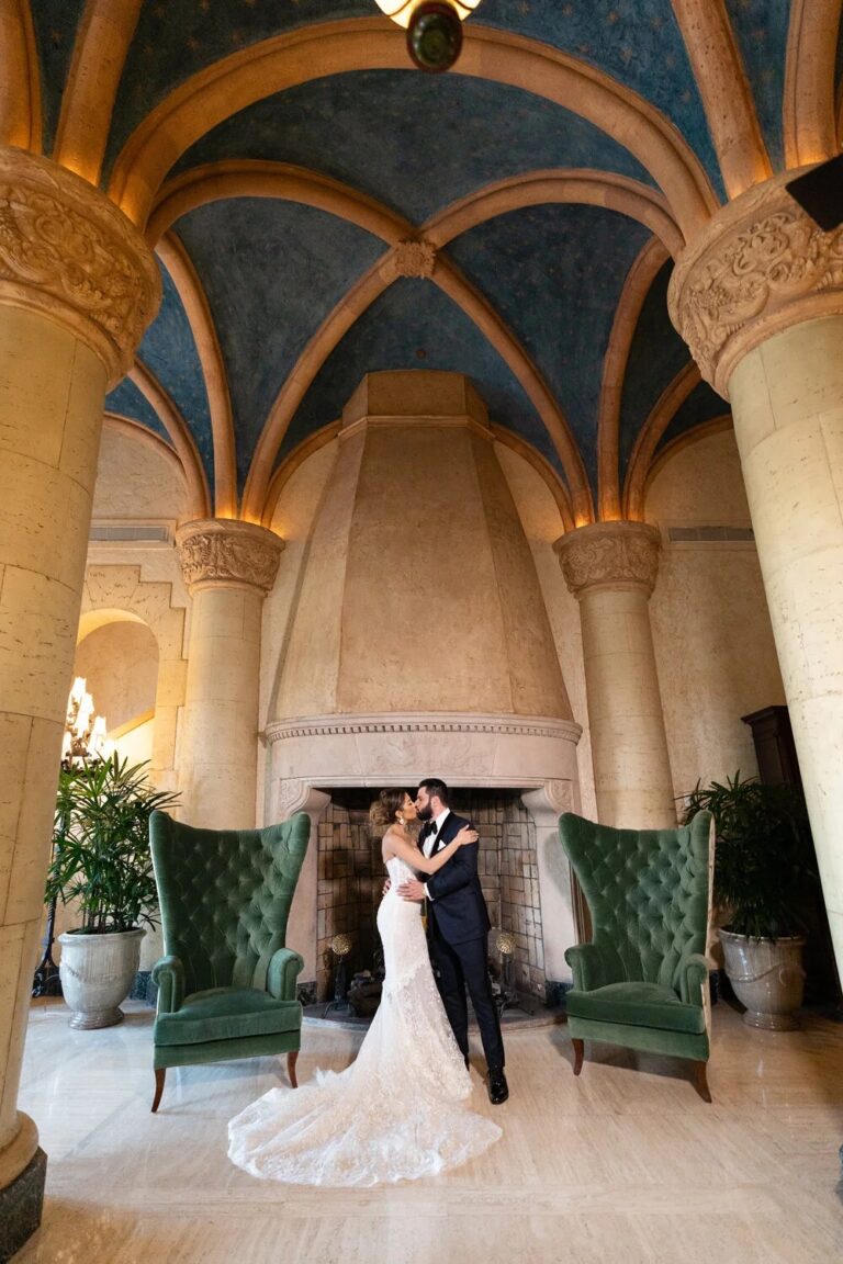 Couple by a fireplace in an arched hall, Vizcaya Museum and Gardens, Miami, Duke Photography