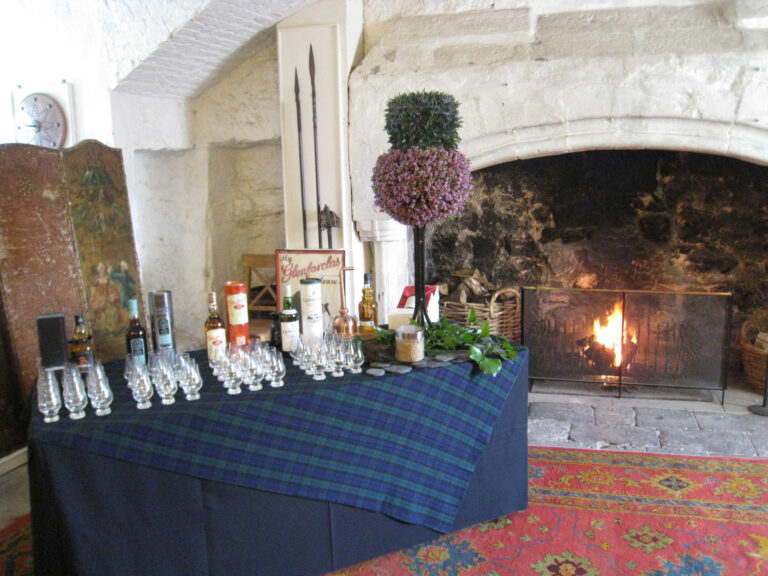 A whisky tasting set beside the open fire in the Armoury of the Auld Keep, Dundas Castle