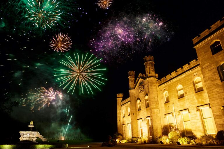 Fireworks over the floodlit castle at night, Dundas Castle