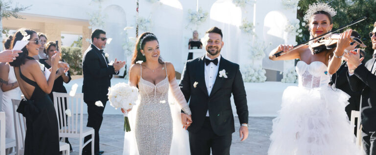 The recessional with a violinist playing beside the couple, Puglia, Elisa Prati Wedding Italy