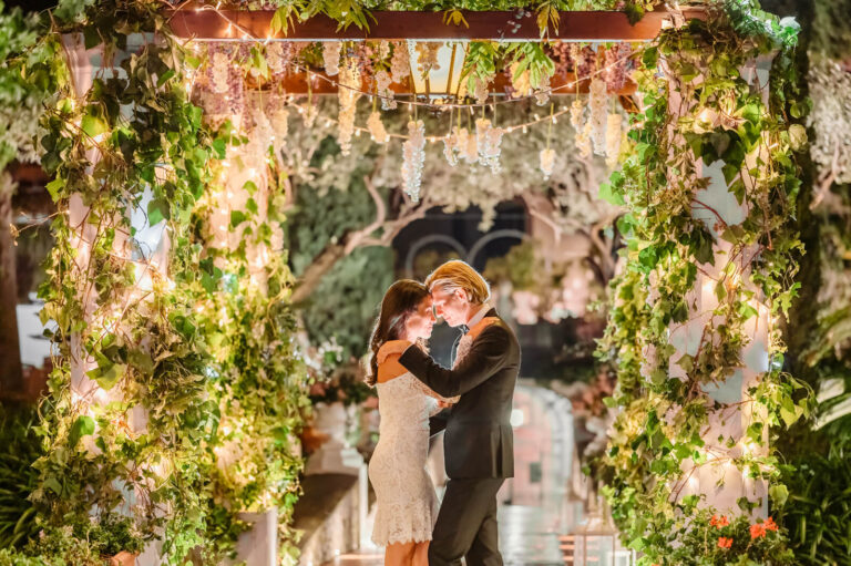 The first dance under a pergola hung with flowers and greenery, Amalfi Coast, Elisa Prati Wedding Italy