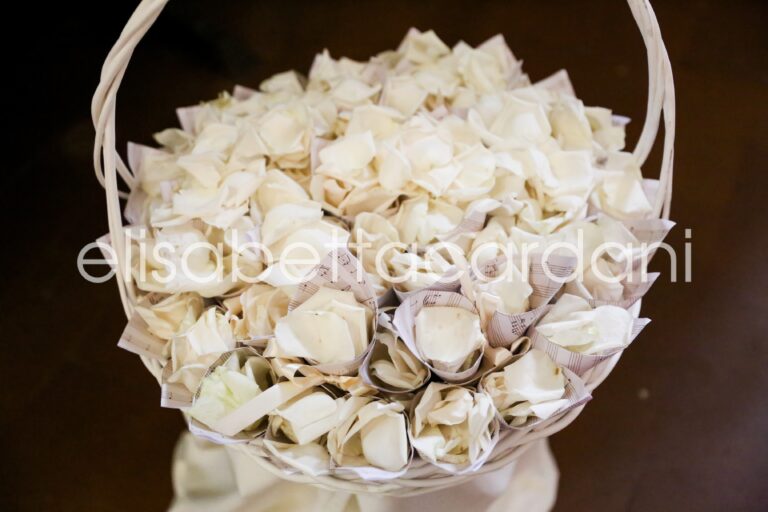 A flower girl's basket of white rose petals, Elisabetta Cardani