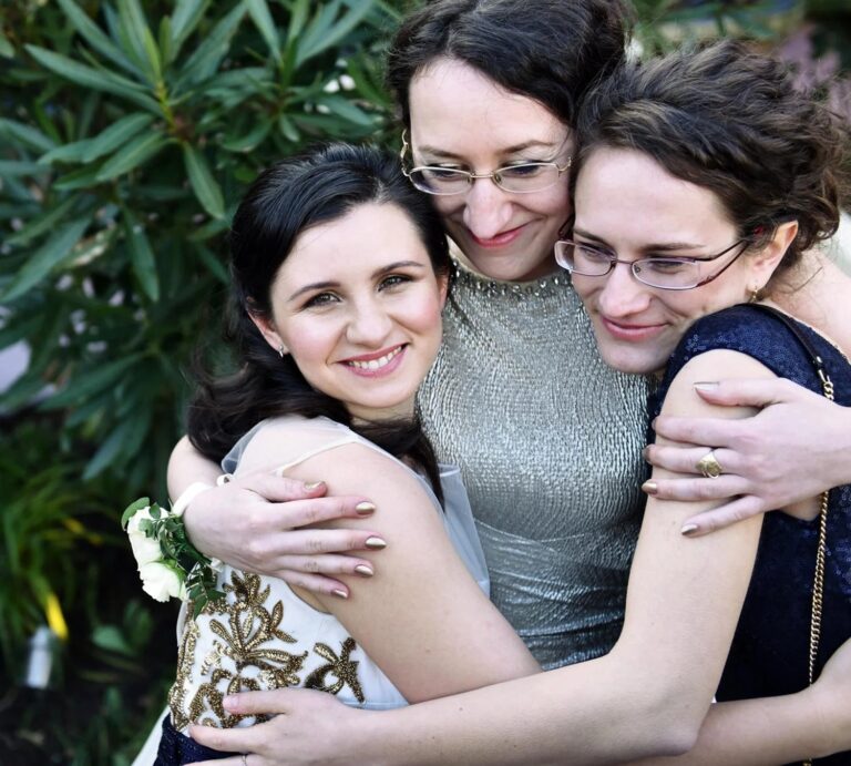 Three bridesmaids embracing, Kensington Roof Gardens, Elizabeth Hsieh Make Up Artist