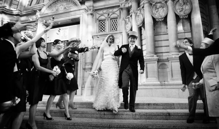 A bride and groom leaving Westminster Cathedral through a line of confetti, Elizabeth Hsieh Make Up Artist