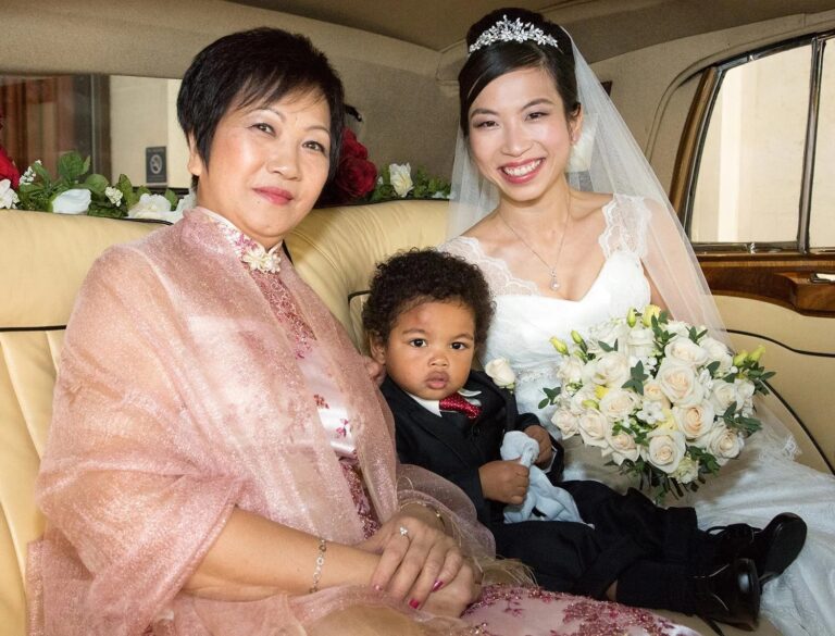 A bride with her mother and a young pageboy in the wedding car, Elizabeth Hsieh Make Up Artist