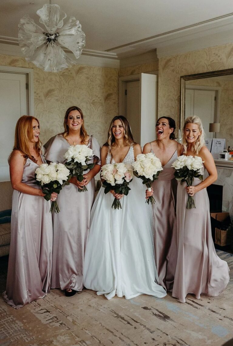 Five bridesmaids in dusty pink, holding white bouquets, Coworth Park, Elizabeth Hsieh Make Up Artist