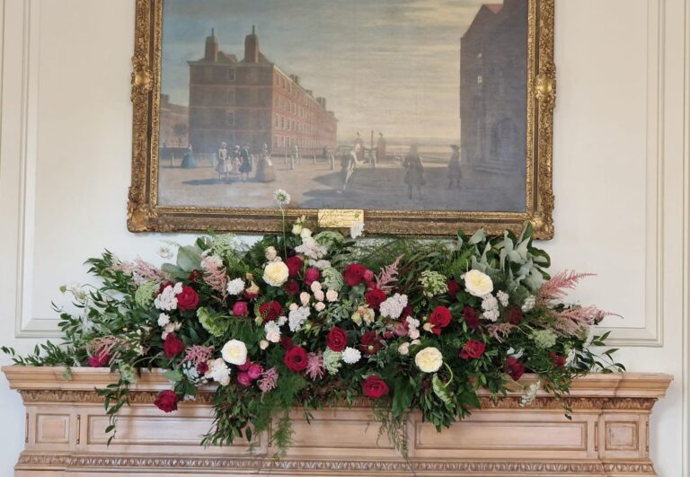 A mantlepiece arrangement in burgundy, blush and cream, Inner Temple Hall, Elizabeth Marsh Floral Design