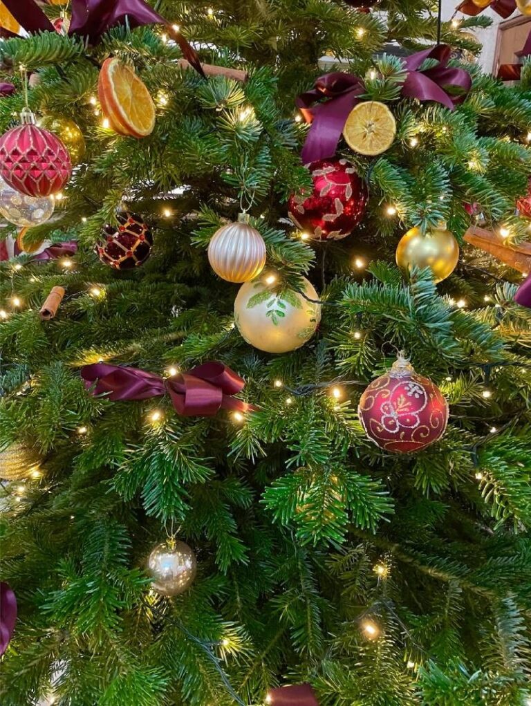 A detail of the Church House Christmas tree, burgundy and gold, Elizabeth Marsh Floral Design