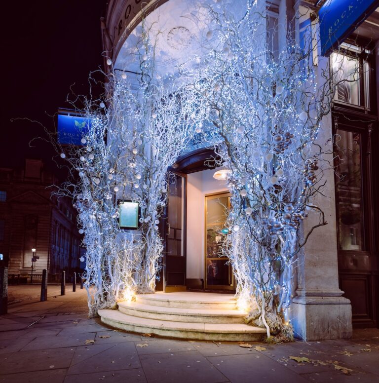 The same installation at Rockwell's, lit after dark, Elizabeth Marsh Floral Design