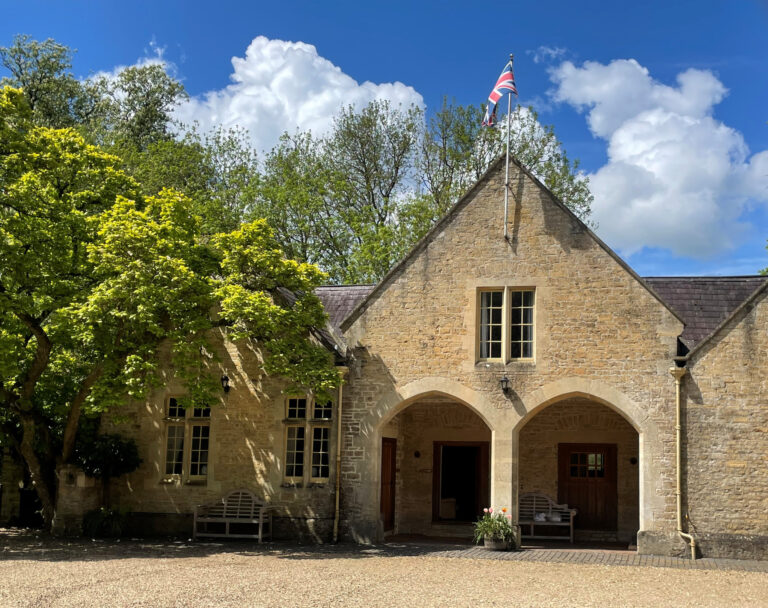 Stone gables and arched doorways in the Elmhay Village courtyard, behind the Orangery, Elmhay Park