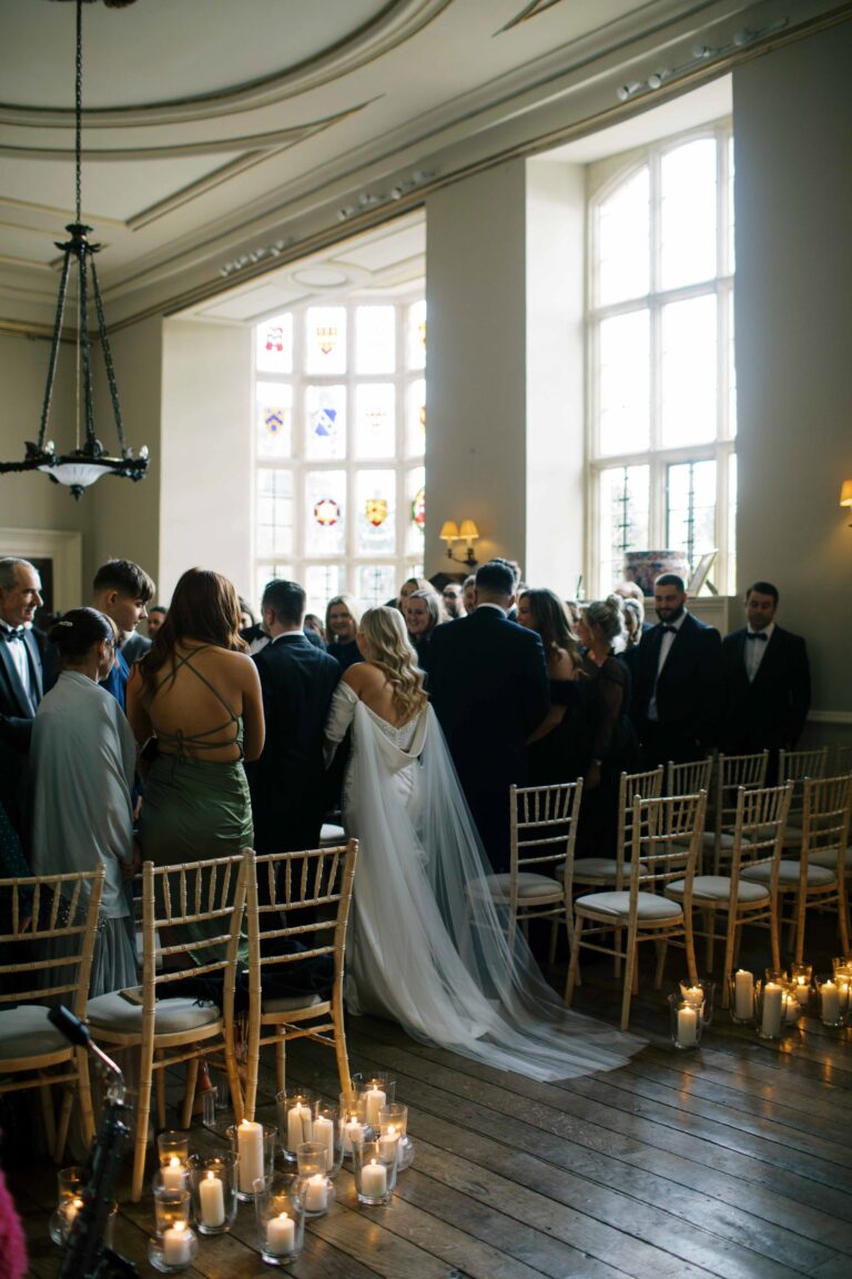 A ceremony in the main house, the bride entering as guests rise, Elmore Court