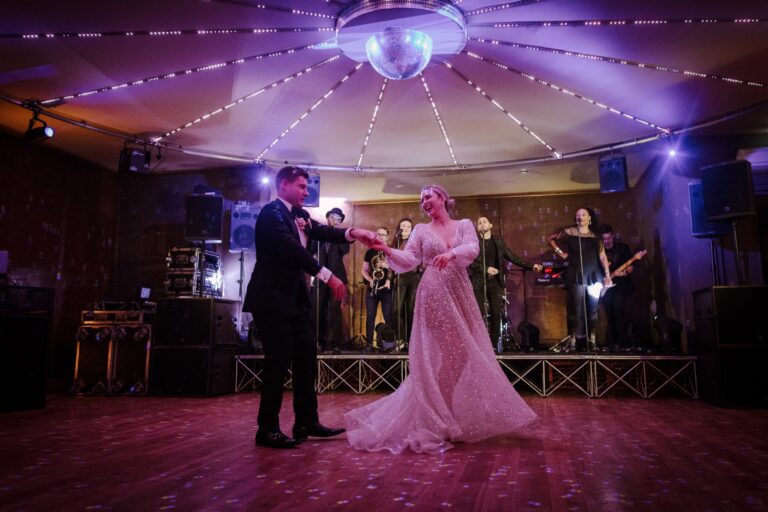 The first dance under coloured light, the band playing behind, Elmore Court