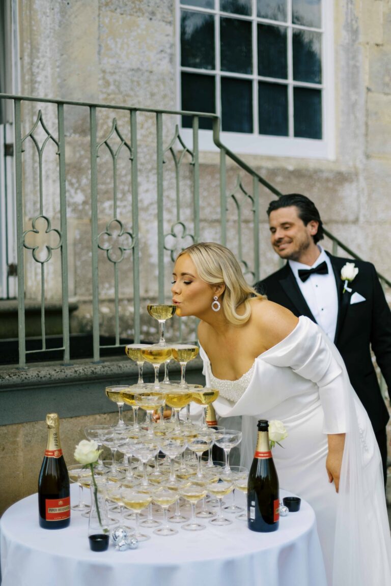 A couple beside a champagne tower, Elmore Court