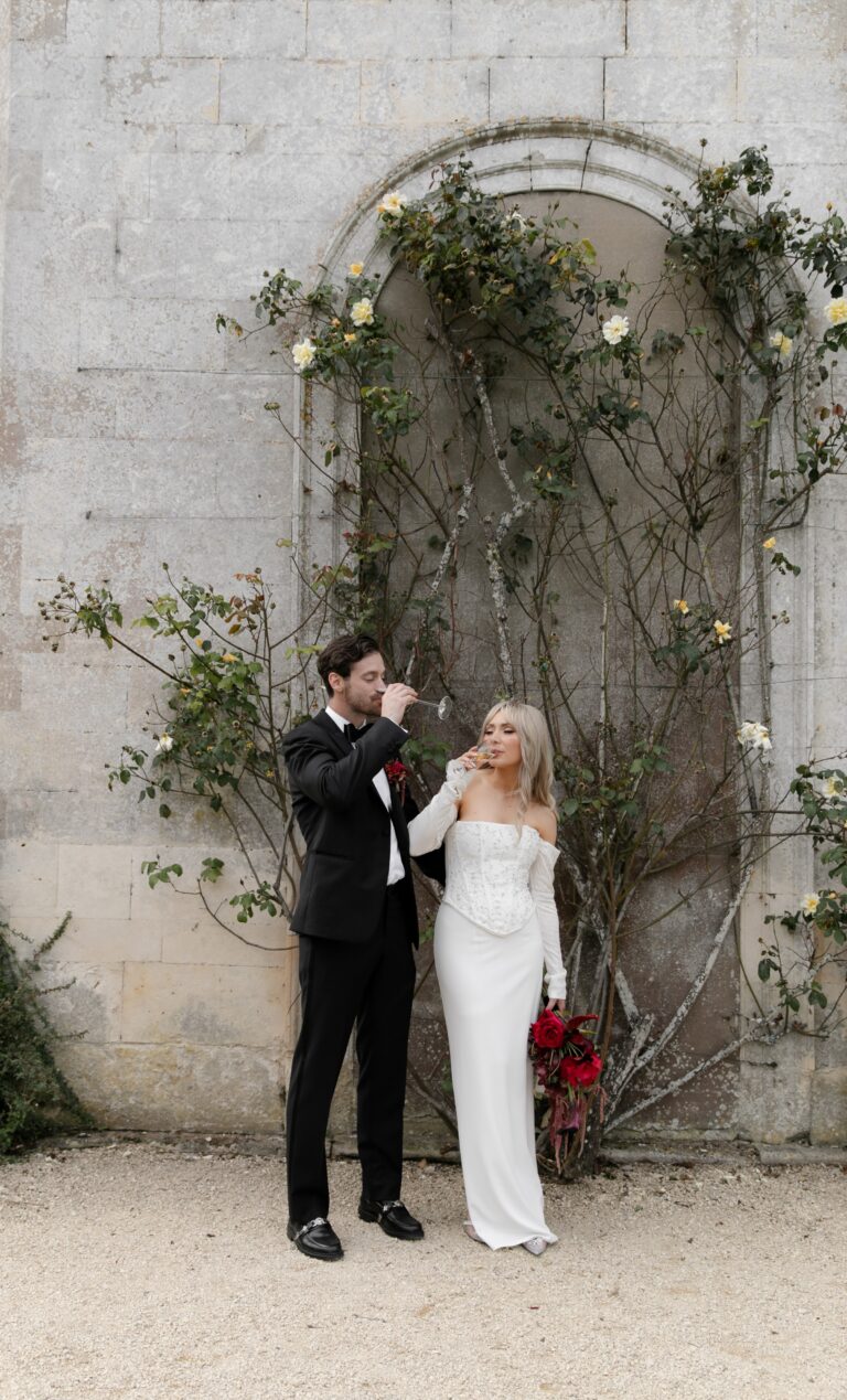 A couple by a foliage-covered wall, Elmore Court