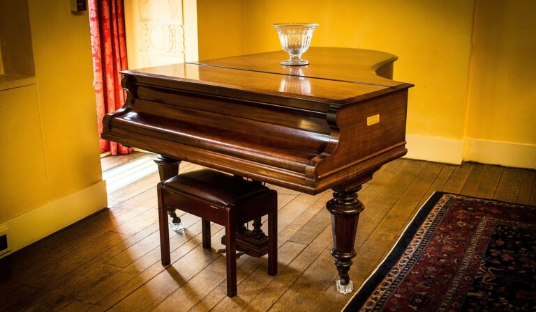 A mahogany grand piano in the yellow Drawing Room, Eltham Palace