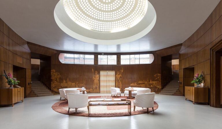 The Art Deco Entrance Hall in full, its glass dome, marquetry murals and twin staircases, Eltham Palace