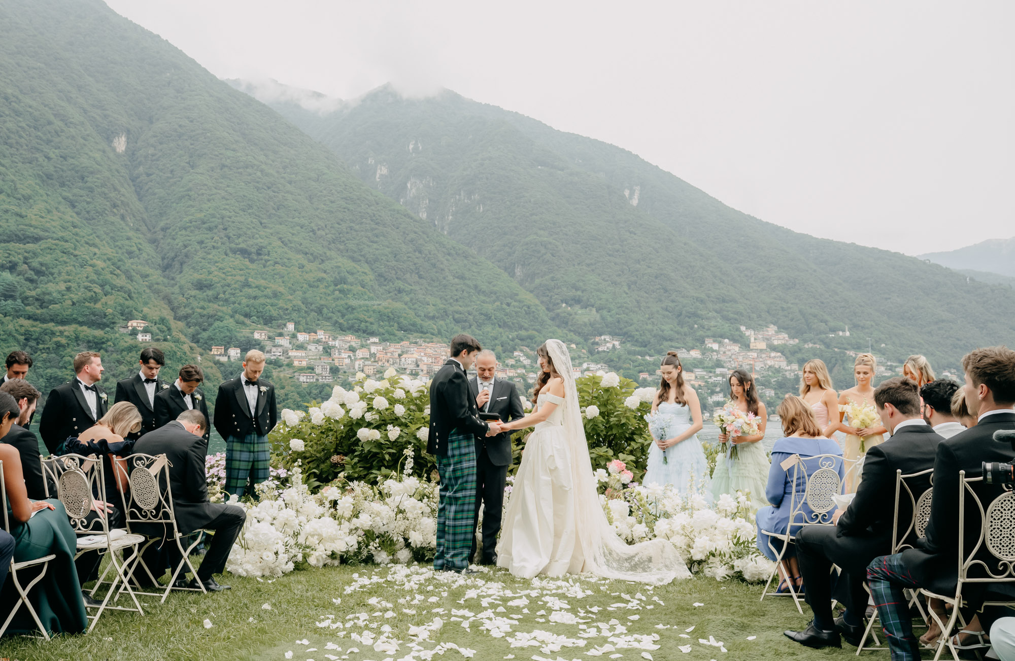 A garden ceremony above Lake Como at Villa Regina Teodolina, the groom and groomsmen in tartan, Emma-Jane Photography