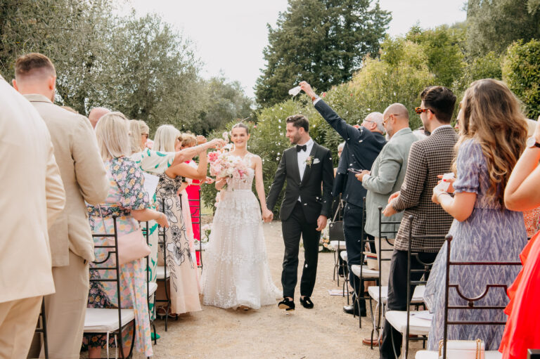 Guests cheering the couple back down the aisle at an intimate wedding in the South of France, Emma-Jane Photography
