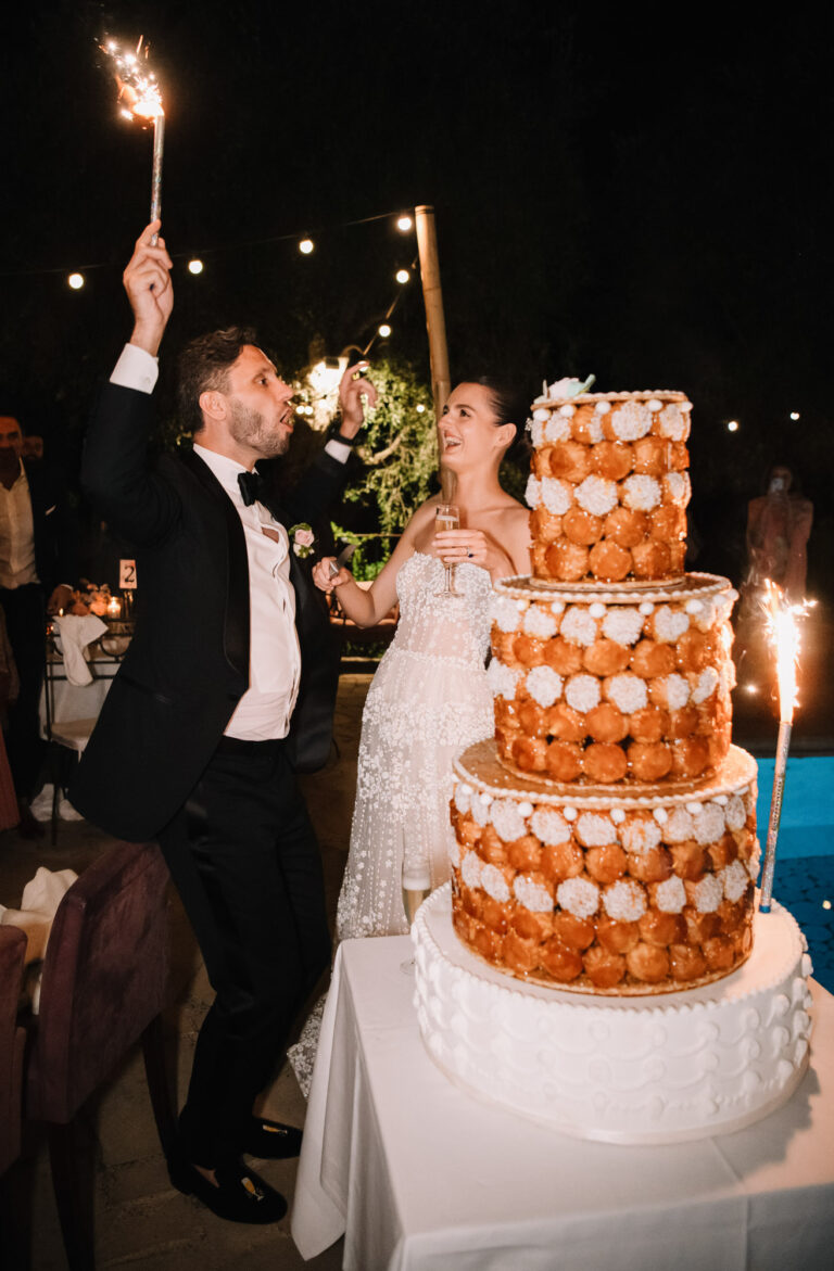 The couple with a croquembouche and sparklers on a wedding night in the South of France, Emma-Jane Photography