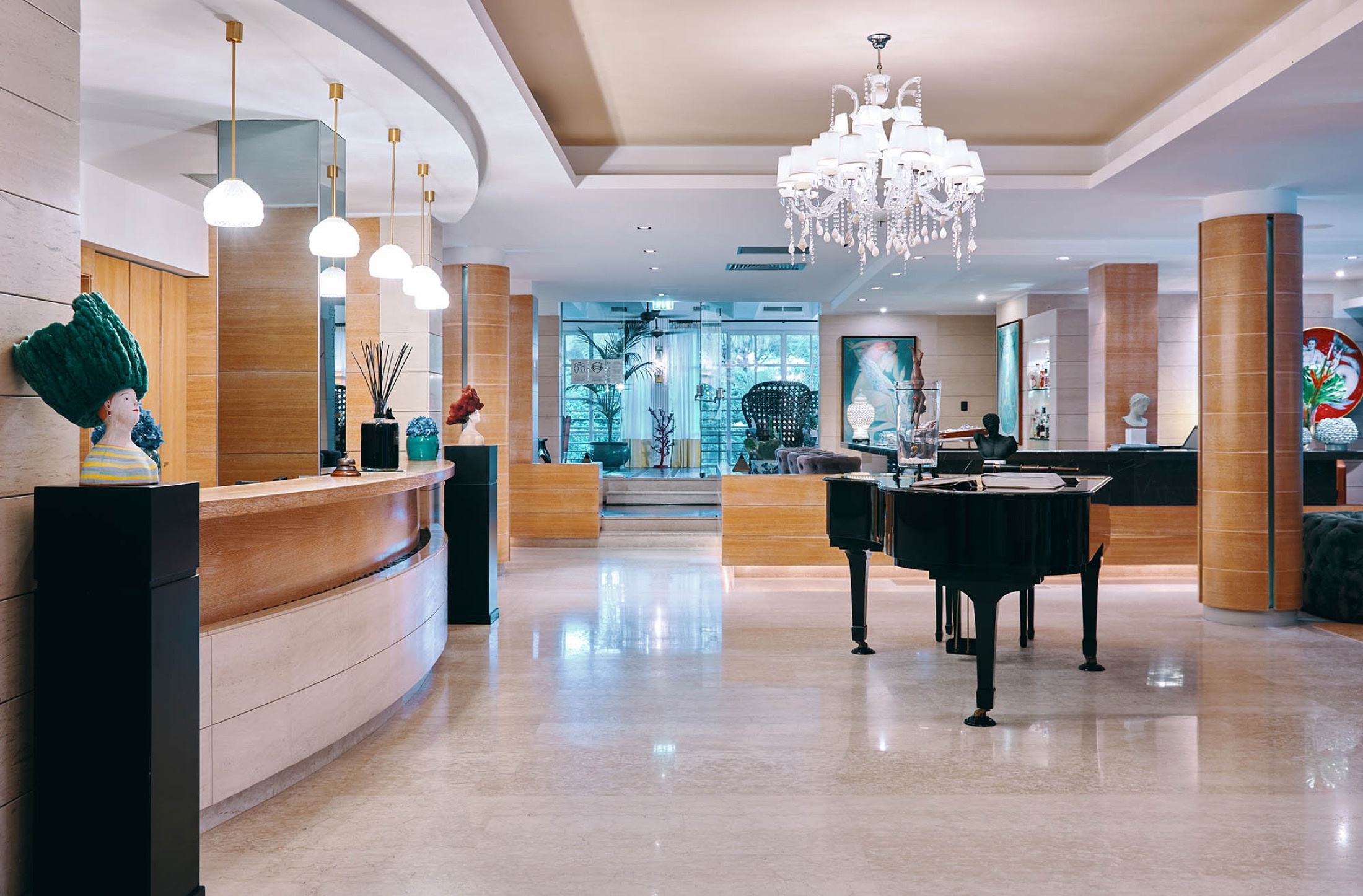 The grand-piano lobby, opening to the pool, Esplanade Boutique Hotel