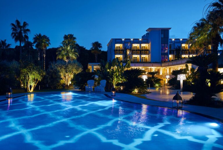The hotel at night, the pool lit in the garden, Esplanade Boutique Hotel