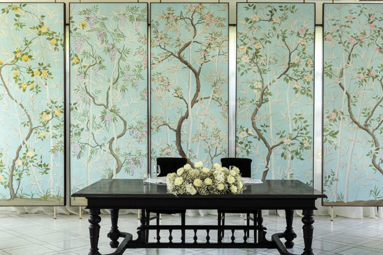 The chinoiserie dining room, set with a long table, Esplanade Boutique Hotel