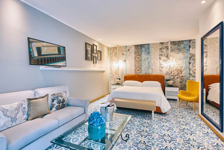 A suite sitting room, in blue and bamboo, Esplanade Boutique Hotel