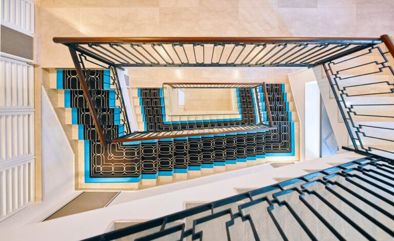 The blue-tiled spiral staircase, from above, Esplanade Boutique Hotel