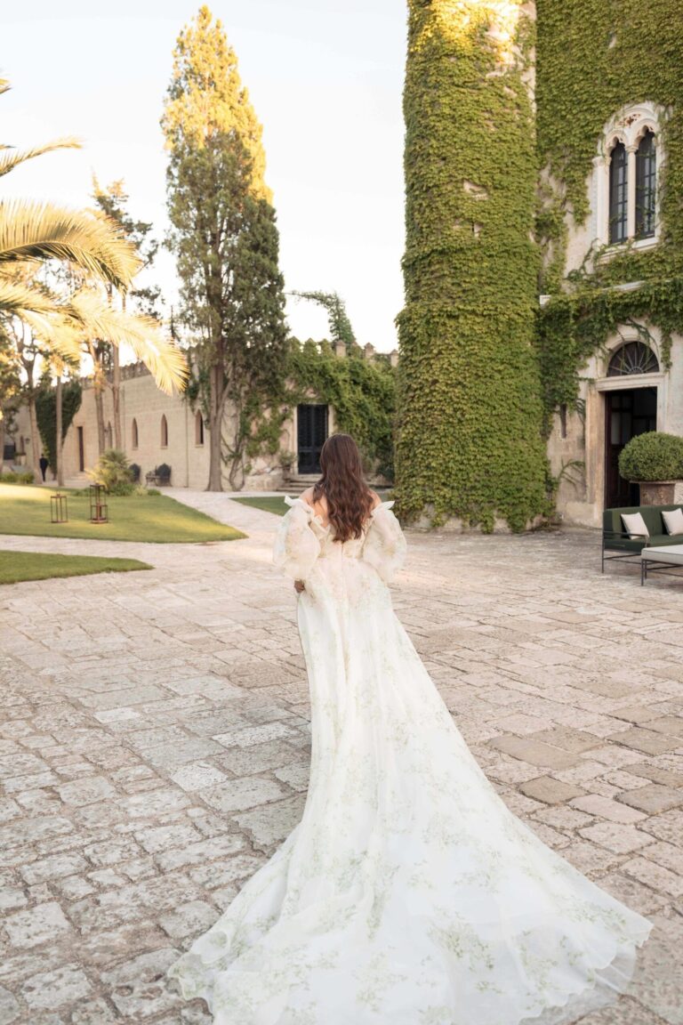 The bride crossing the lawn toward the ivy-covered tower, Ester Chianelli Weddings & Events