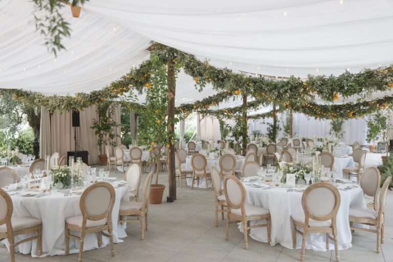 A marquee dressed with citrus and greenery garlands, Ester Chianelli Weddings & Events