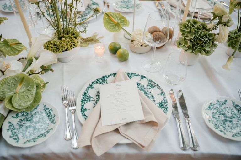 Green and white ceramics, limes and calla lilies on the linen, Ester Chianelli Weddings & Events