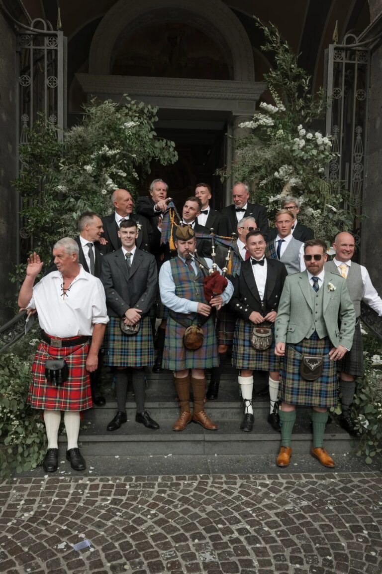 The men on the steps, six of them in kilts, Ester Chianelli Weddings & Events