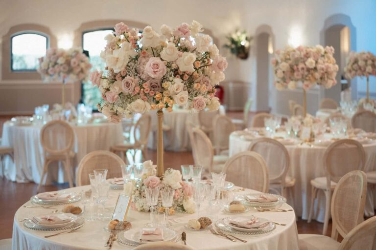 Round tables at Tenuta Sant'Antonio with tall blush rose and hydrangea centrepieces, Eventilab Weddings