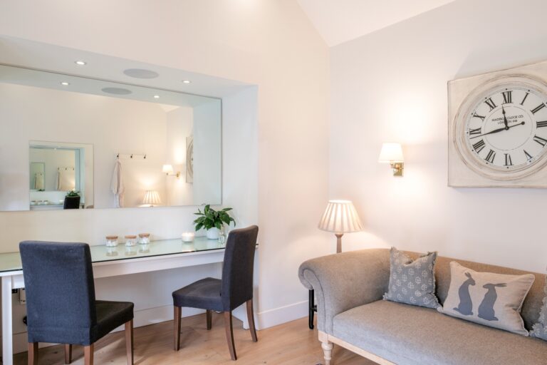 The preparation room off the suite, with a long mirror, dressing table and sofa, Farbridge