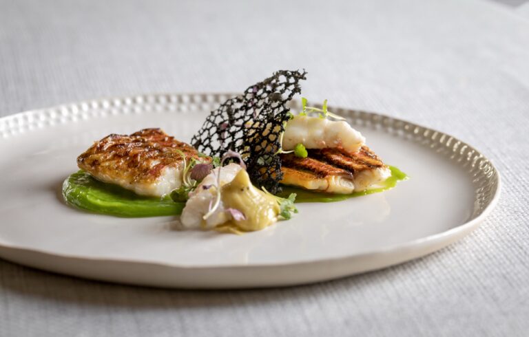 A fish course on a pea purée with crisp seaweed tuile, Farbridge