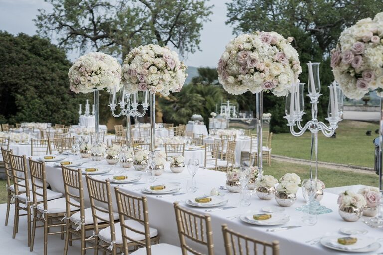 An outdoor reception, blush centrepieces beneath the trees, Farima Perry Florals and Events