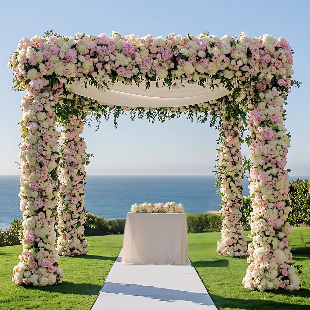 A blush and white chuppah, overlooking the sea, Farima Perry Florals and Events